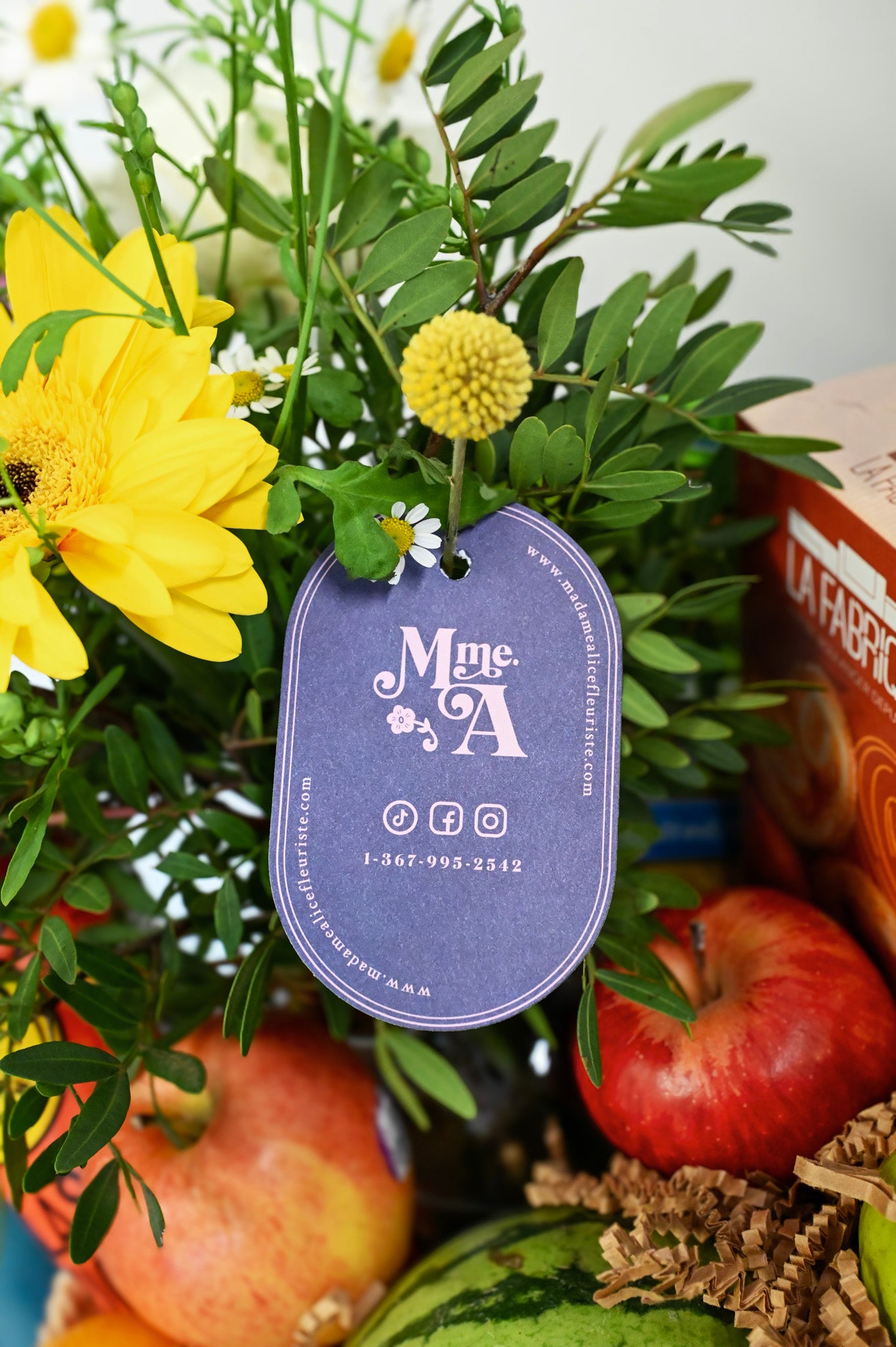 Basket of fruits, flowers and delicacies