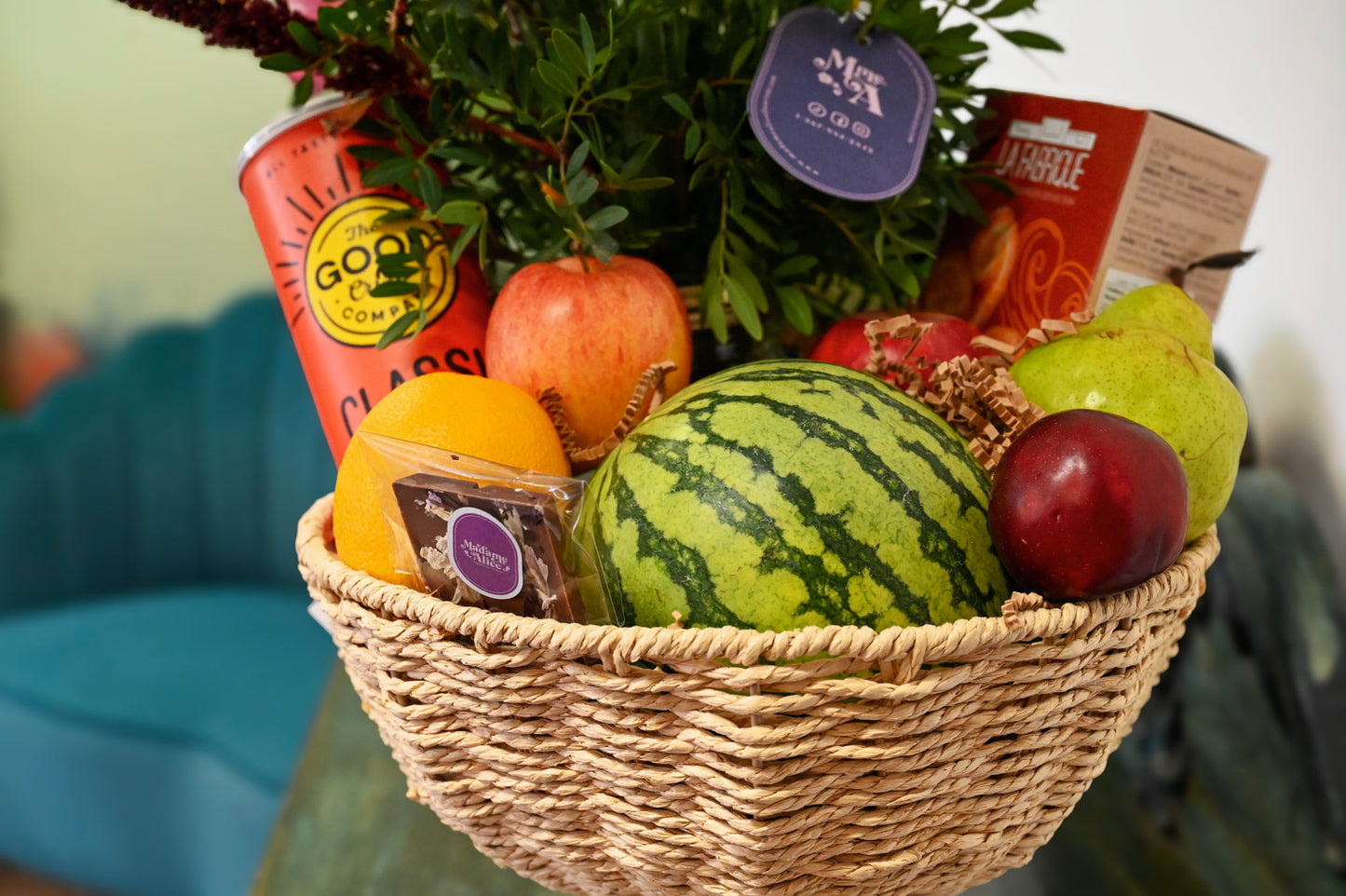 Basket of fruits, flowers and delicacies